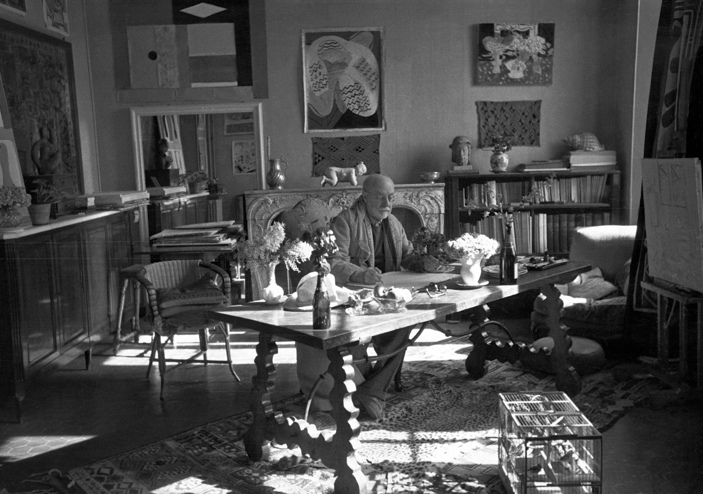 Matisse with his collection of Kuba cloths and a Samoan tapa on the wall behind him by Henri-Cartier Bresson